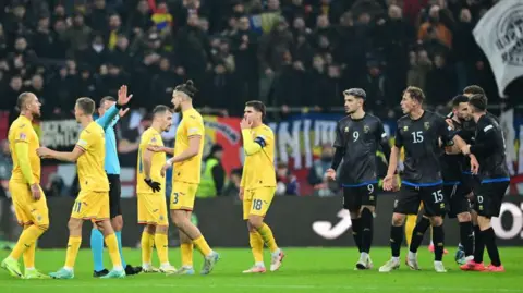 Kosovo and Romania players arguing