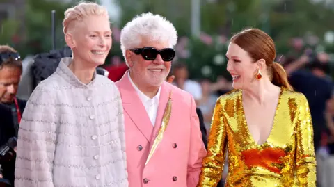 Getty Images Tilda Swinton, Pedro Almodovar and Julianne Moore attend the "The Room Next Door" red carpet during the 81st Venice International Film Festival on September 02, 2024 in Venice, Italy. 