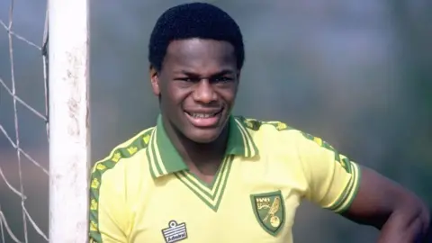 Justin Fashanu in a Norwich City FC kit