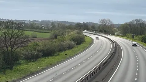 The A1 in Nottinghamshire near North Muskham. There are only a couple of cars on the carriageways after the road had recently reopened. 