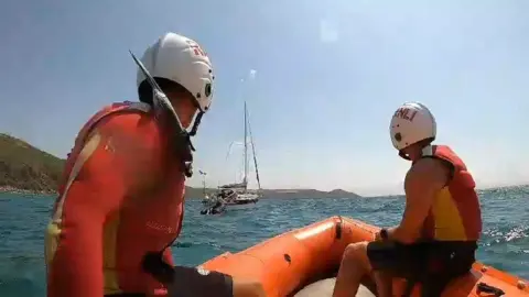 RNLI RNLI lifeguards during rescues along Whitsand Bay