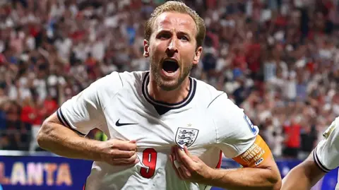 England striker Harry Kane celebrates scoring against DR Congo
