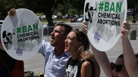 Getty Images Anti-abortion activists participate in a "#BanChemicalAbortions" protest outside of the Department of Health and Human Services (HHS) June 28, 2022 in Washington, DC