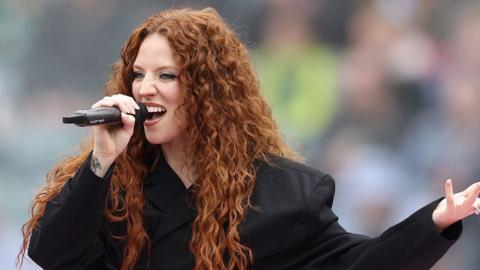 Jess Glynne performs ahead of the Gallagher Premiership Rugby match between Harlequins and Northampton Saints at Twickenham Stadium on April 27, 2024 in London