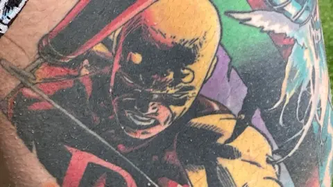 Simon Spark / BBC Tattoo of Daredevil in yellow