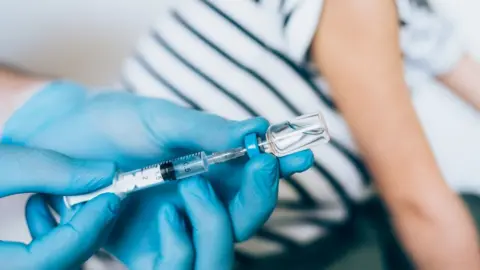 Getty Images A needle in covid vaccine