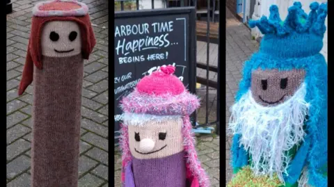 The Knitoholics A collage with three photos next to each other. The pictures show knitted covers placed over bollards depicting characters from the nativity. This picture shows Joseph and two wise men.