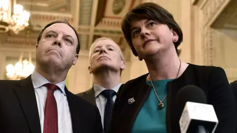 Getty Images The DUP's Nigel Dodds, Gregory Campbell and Arlene Foster