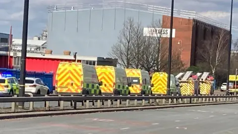 Emergency service vehicles on Tenax Road