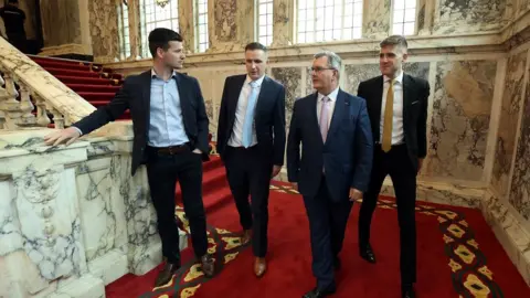 Liam McBurney Jonathan Buckley MLA, Councillor Andrew McCormick, DUP leader Sir Jeffery Donaldson and Councillor Dean McCullough at the Northern Ireland council elections at Belfast City Hall