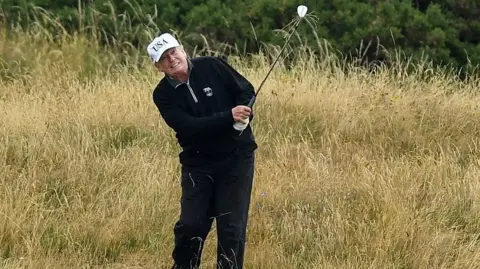 Getty Images Donald Trump playing golf on a visit to Trump Turnberry