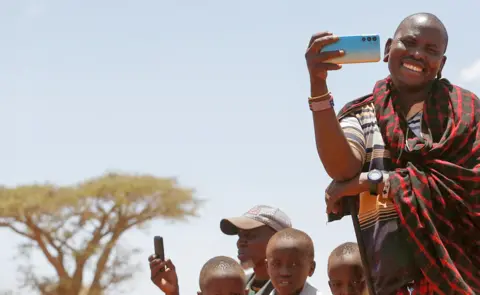 Reuters A Maasai man using his mobile phone to record in a village in Kajiado County, Kenya - Sunday 26 February 2023