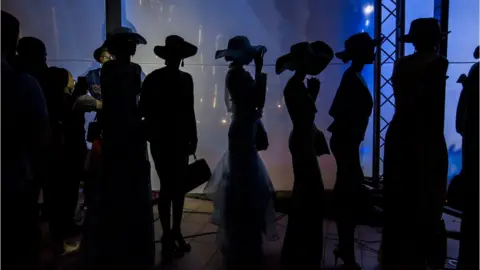 Marta Moreiras A group of models wait patiently moments before a show at Radisson Blu Hotel during Dakar Fashion Week in Dakar, Senegal