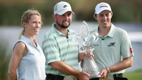 Matt and Alex Fitzpatrick hold the Zurich Classic of New Orleans trophy