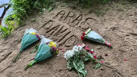 Floral tributes at scene