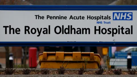 PA Media The sign for Royal Oldham Hospital.
