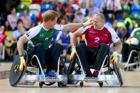 Getty Images Prince Harry and Mike Tindall competing successful  a wheelchair rugby lucifer  successful  2014, London