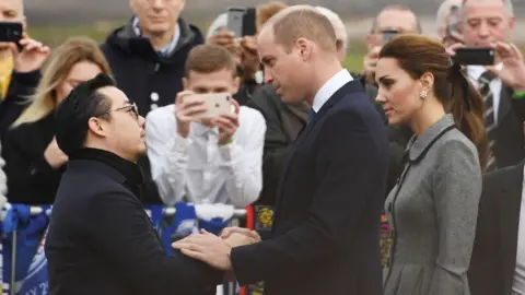 PAUL ELLIS/AFP/Getty Images Aiyawatt Srivaddhanaprabha, Mr Vichai's son, and the Duke and Duchess of Cambridge