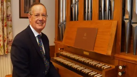 Worcester Cathedral Organist at the organ