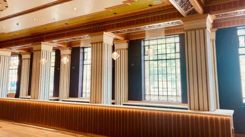 Bradford Live Ornate glasswork in windows are framed by original decorative tiles