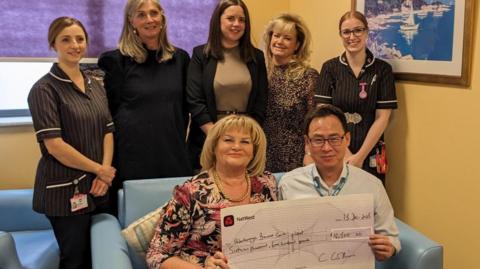 Cheque being presented by Carol Collier to PCH staff