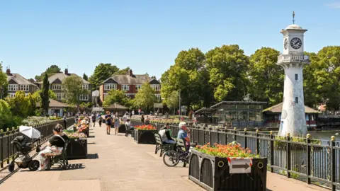 Getty Images Clock tower and seating area on the promenade around Roath Lake in Cardiff