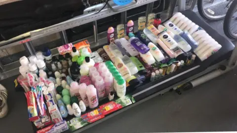 Michelle Carless Toiletries on the floor