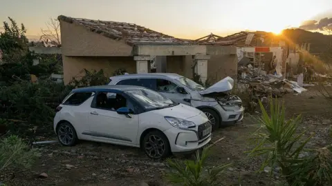 AFP via Getty Images Damaged houses after a tornado struck Pomas, southwestern France