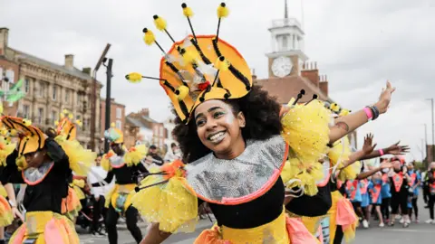 Stockton Borough Council A girl dressed as a bee mid-performance.