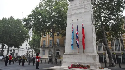 PA Media Wreaths around the Cenotaph on 15 August 2020