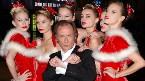 Getty Images Bill Nighy played the fictional rock star Billy Mack