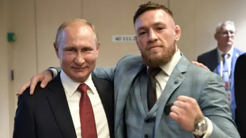 AFP/Getty Vladimir Putin and Conor McGregor