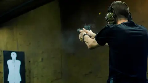 AFP/Getty Images Brazilian reserve militaryman Rildo Anjos shoots at a target