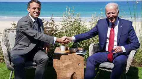 Reuters U.S. President Joe Biden and France"s President Emmanuel Macron shake hands as they attend a bilateral meeting during the G7 summit in Carbis Bay, Cornwall, Britain