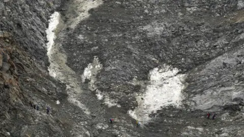 Getty Images Climbers trying to cross a dangerous corridor on Mount Blanc