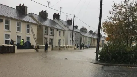 Angharad Lewis One of the main streets in Llanybydder, Carmarthenshire, has been hit by flooding