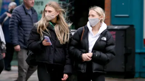 PAcemaker Two young women in Belfast as further lockdown restrictions are imposed