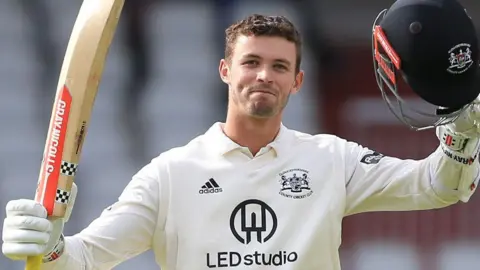 Ollie Price celebrates scoring 200