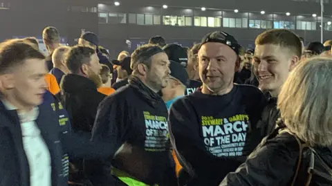 BBC Marcus Stewart among crowds outside Ipswich Town stadium.