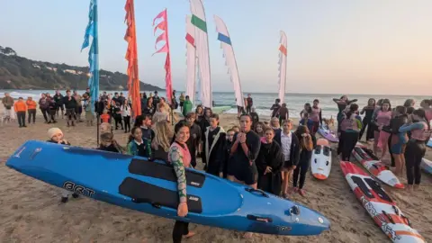 Hayle Surf Life Saving Club Paddleboarders on beach 