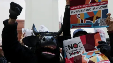 Animal rights activists take part in a demonstration demanding the approval of a law that prohibits bullfights and events where animals are abused, during a debate at the Colombian congress in Bogota, Colombia May 8, 2024. 