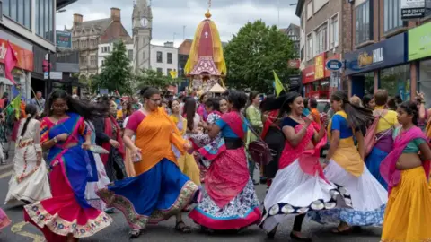 ISKCON Leicester A previous Festival of Chariots event in Leicester with a group of people dancing with brightly-coloured clothes