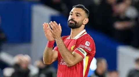 Liverpool striker Mohamed Salah applauds