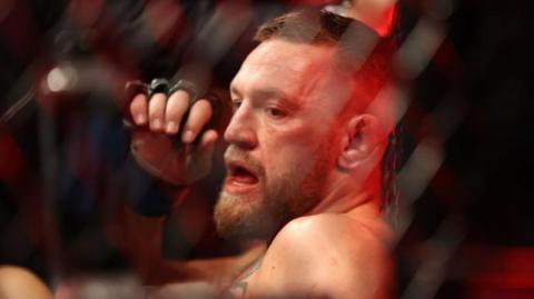 Conor McGregor in the cage after a fight