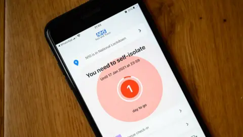 Getty Images The NHS contact-tracing app is seen with one day left on a self-isolation timer