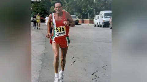 Eric Hughes Eric Hughes takes part in the Malta Half Marathon 2003 