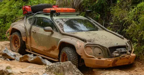 Amazon Studios The team driving in Madagascar