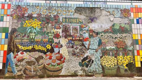 Large chunks can be seen to be missing from Kenneth Budd's mural 