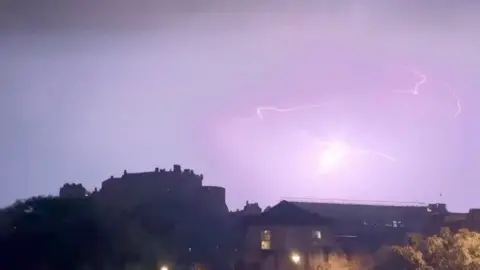 Lightning flashes over Edinburgh Castle