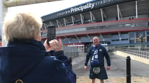 Getty Images A Scottish fans outside the Principality Stadium